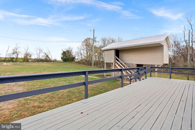 wooden terrace featuring a yard