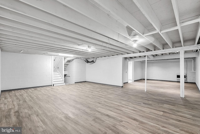 basement featuring hardwood / wood-style flooring