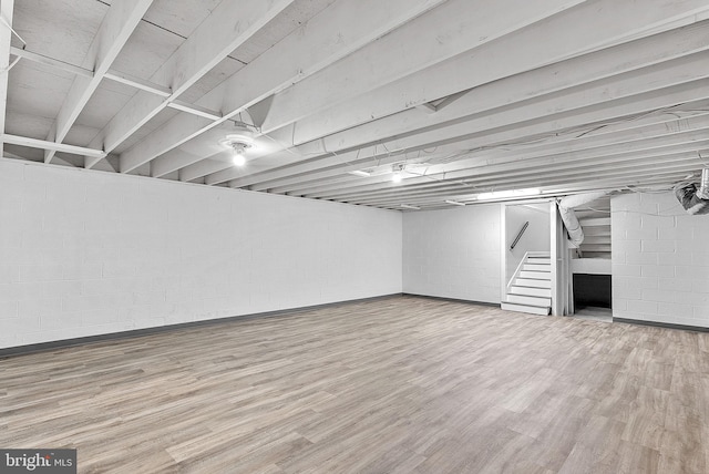 basement with wood-type flooring