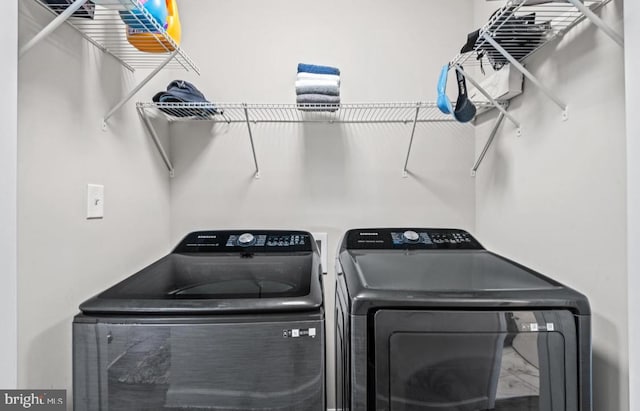 laundry room featuring washing machine and dryer