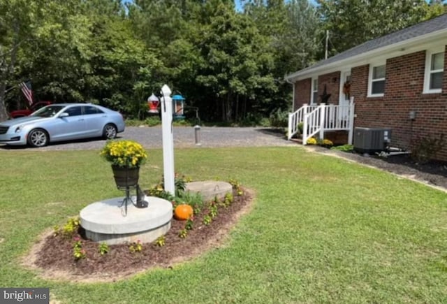 view of yard featuring central AC unit