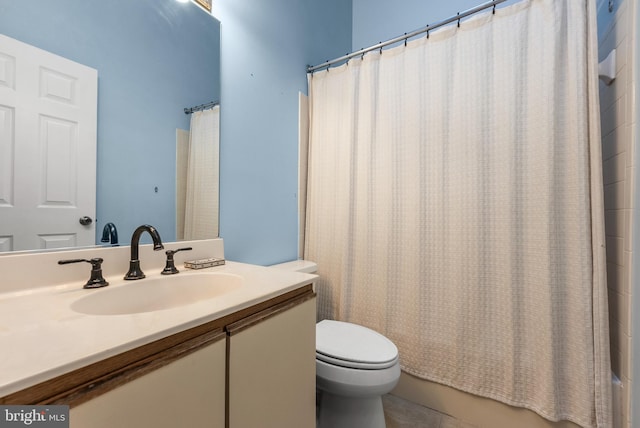 full bathroom with tile patterned flooring, vanity, shower / bath combo, and toilet