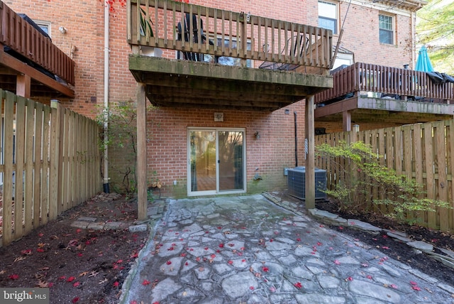 view of patio / terrace with a balcony and cooling unit