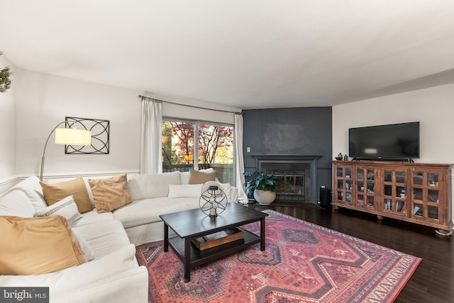 living room with dark hardwood / wood-style floors