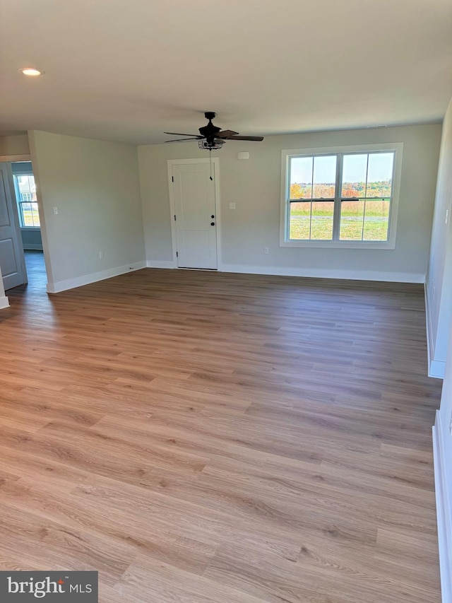 interior space with ceiling fan and light wood-type flooring