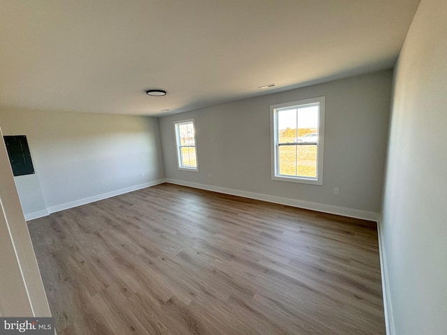 spare room featuring light wood-type flooring