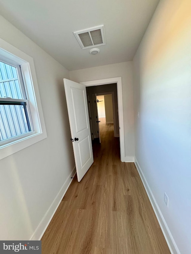 corridor featuring light hardwood / wood-style floors