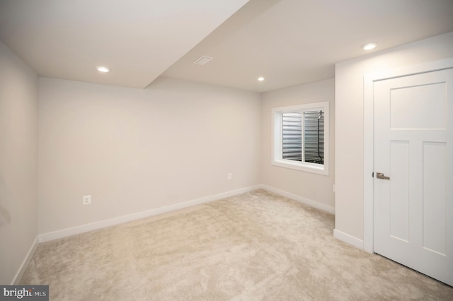 empty room with light colored carpet