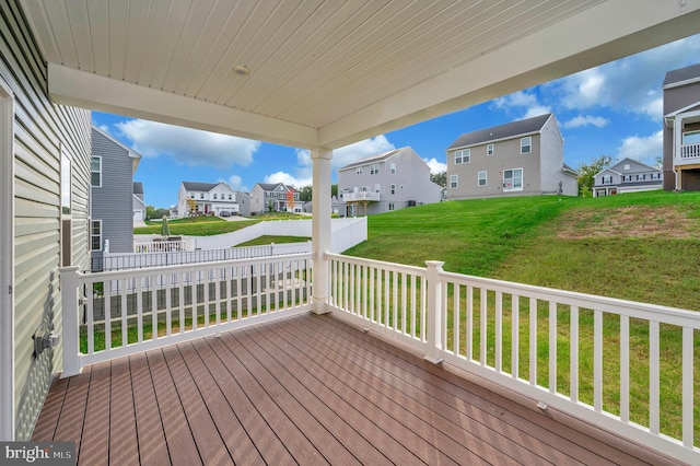 wooden terrace with a yard