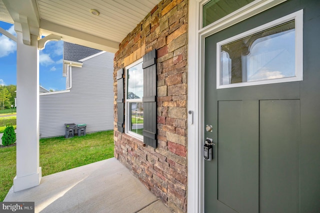 entrance to property featuring covered porch