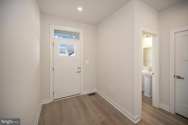 doorway featuring light hardwood / wood-style flooring