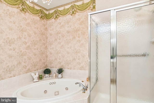 bathroom featuring separate shower and tub