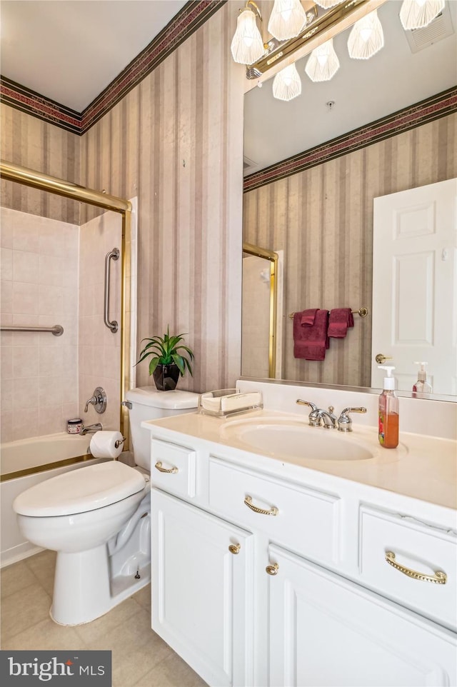 full bathroom with tile patterned flooring, vanity, toilet, and tiled shower / bath combo