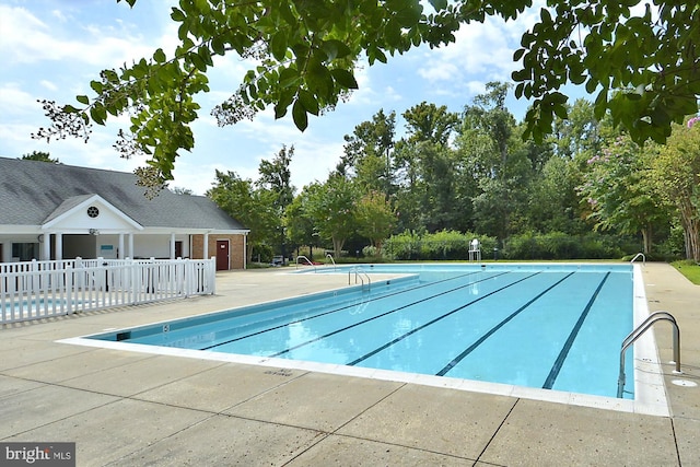 view of pool featuring a patio