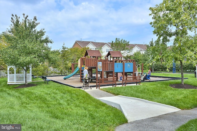 view of playground featuring a lawn