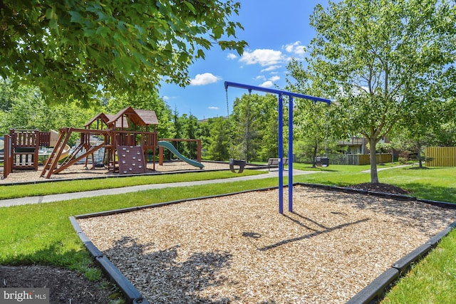 view of playground with a lawn