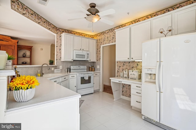 kitchen featuring white cabinets, ceiling fan, white appliances, and sink