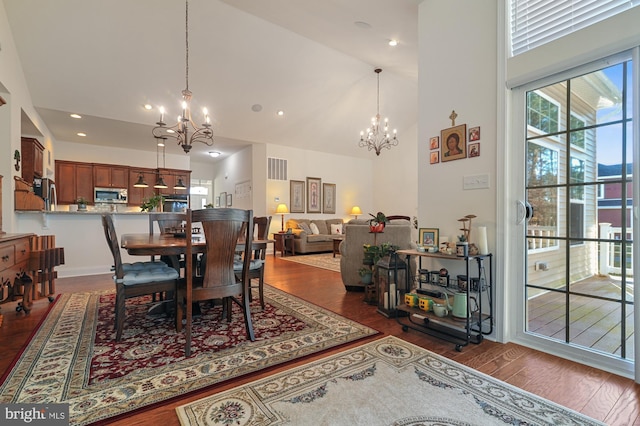 30773 Fowlers Path, Millsboro, DE 19966 - dining area featuring a chandelier, high vaulted ceiling, dark wood-style floors, and recessed lighting