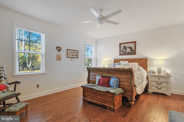 bedroom with dark wood-type flooring and ceiling fan