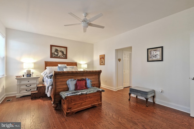 bedroom with dark hardwood / wood-style floors and ceiling fan