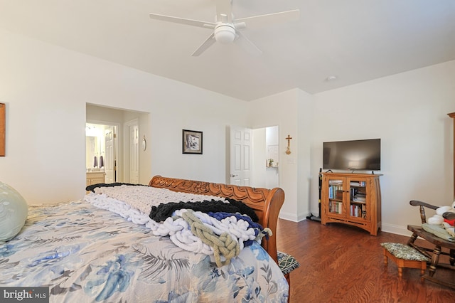 bedroom featuring ceiling fan, dark hardwood / wood-style floors, and connected bathroom