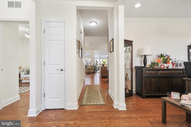 hallway featuring dark hardwood / wood-style flooring