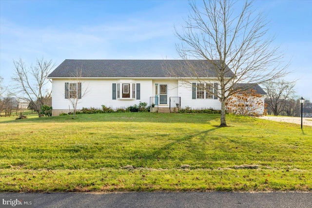 ranch-style house featuring a front lawn