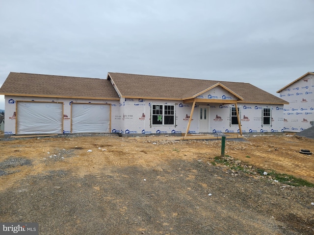 property in mid-construction with an attached garage