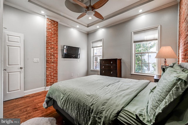 bedroom featuring crown molding, multiple windows, ceiling fan, and dark hardwood / wood-style floors