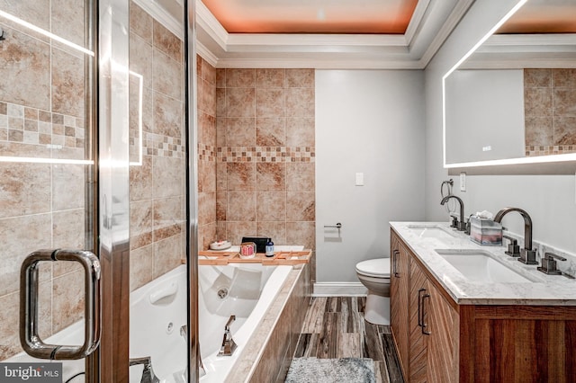 bathroom with wood-type flooring, toilet, tiled tub, vanity, and crown molding