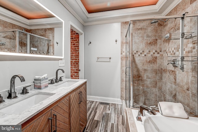 bathroom with separate shower and tub, vanity, and crown molding