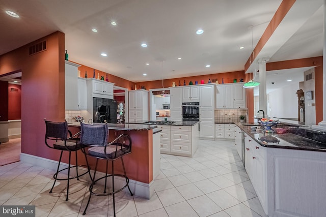 kitchen featuring white cabinetry, black fridge with ice dispenser, sink, decorative backsplash, and kitchen peninsula