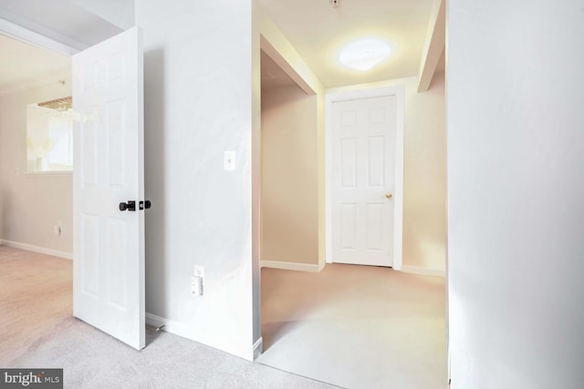 hallway featuring light carpet