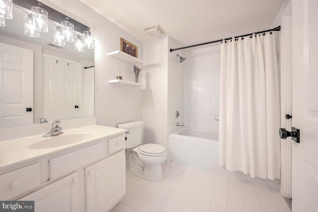 full bathroom featuring tile patterned floors, vanity, toilet, and shower / tub combo with curtain