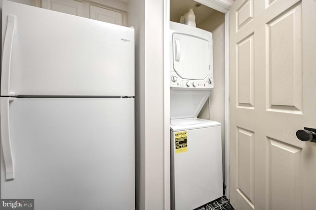 laundry area with stacked washer and dryer