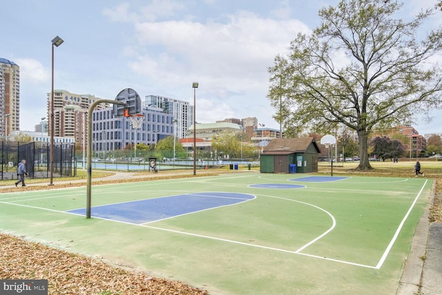 view of sport court featuring tennis court