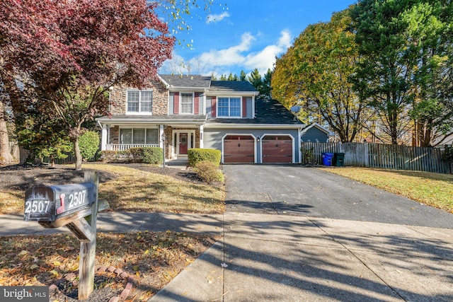 view of front property with covered porch and a front yard