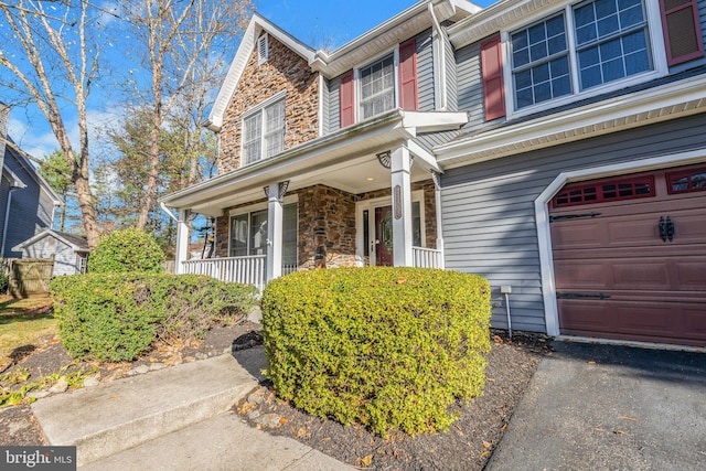 view of front of property with a garage and a porch