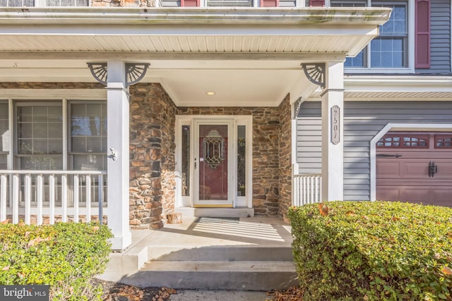 doorway to property with a garage