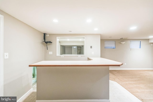 kitchen featuring light colored carpet