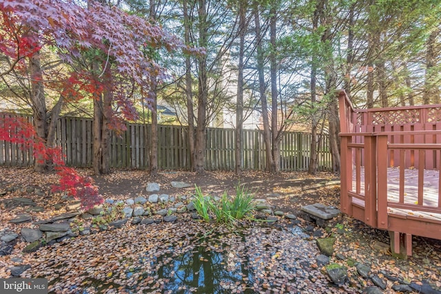 view of yard with a wooden deck