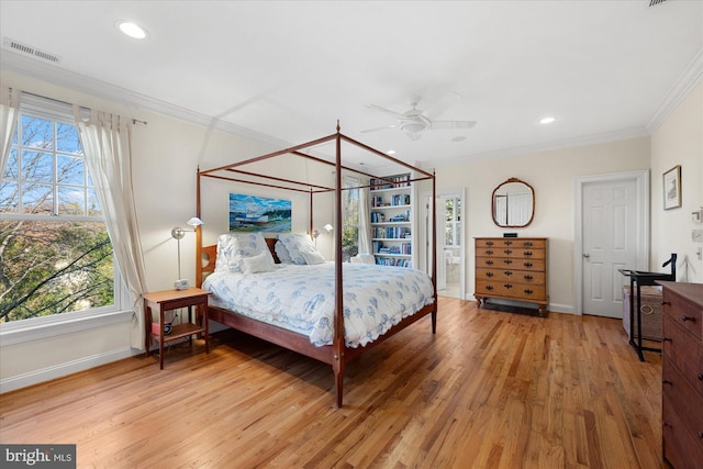 bedroom featuring hardwood / wood-style floors, ceiling fan, and ornamental molding