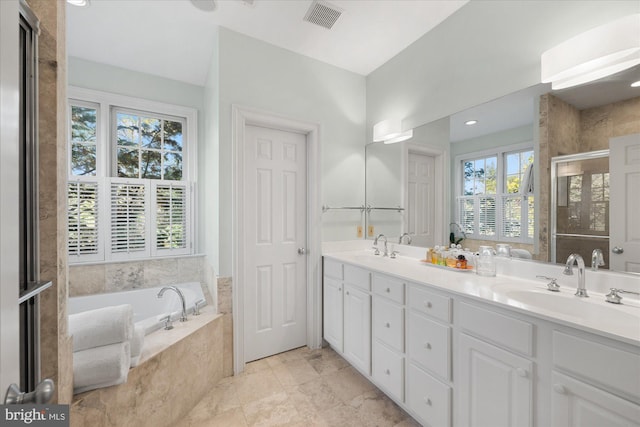 bathroom with independent shower and bath and vanity