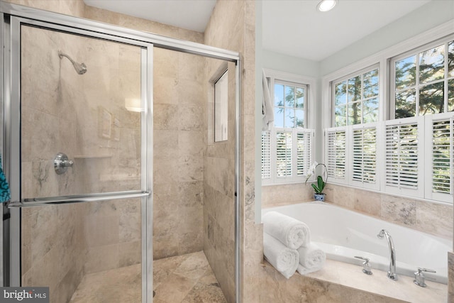 bathroom with shower with separate bathtub