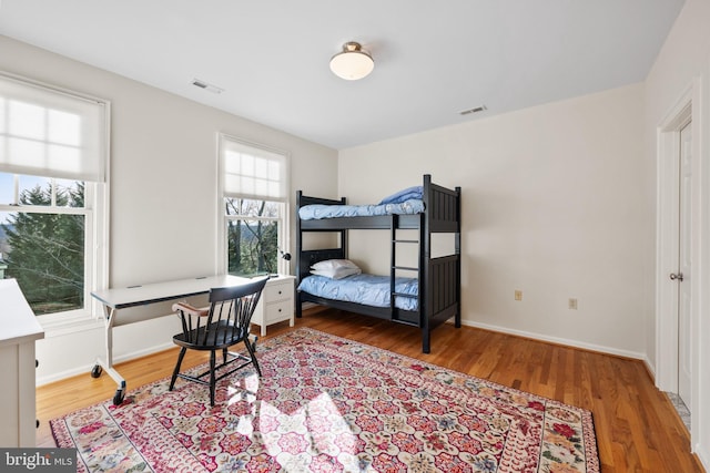 bedroom with hardwood / wood-style flooring