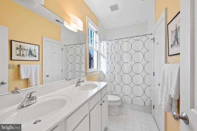 full bathroom featuring toilet, tile patterned flooring, shower / tub combo, and vanity