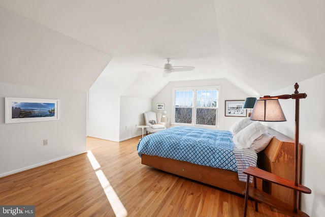 bedroom featuring vaulted ceiling, ceiling fan, and light hardwood / wood-style floors