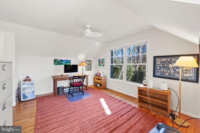 office area featuring ceiling fan, vaulted ceiling, and hardwood / wood-style flooring