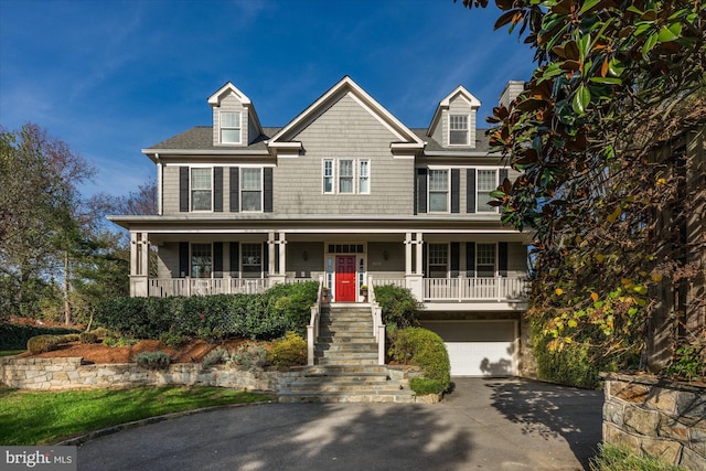 view of front of home with a garage and covered porch