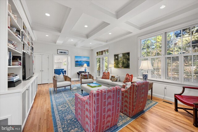 living room with coffered ceiling, light hardwood / wood-style flooring, and beam ceiling